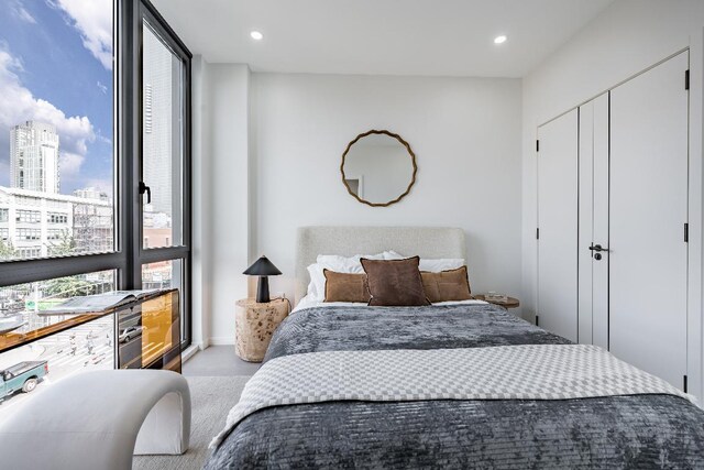 bedroom with a wall of windows