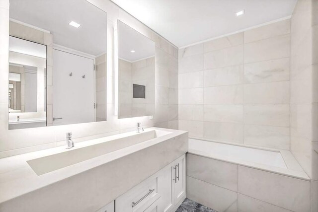 full bathroom featuring shower / bath combination with glass door, vanity, and toilet