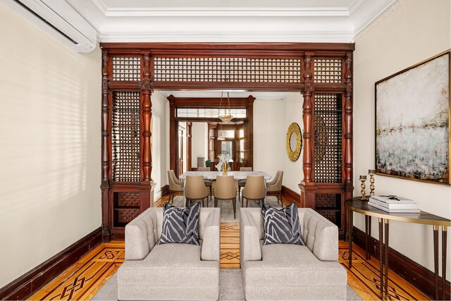 interior space featuring hardwood / wood-style flooring, crown molding, and a wall mounted AC