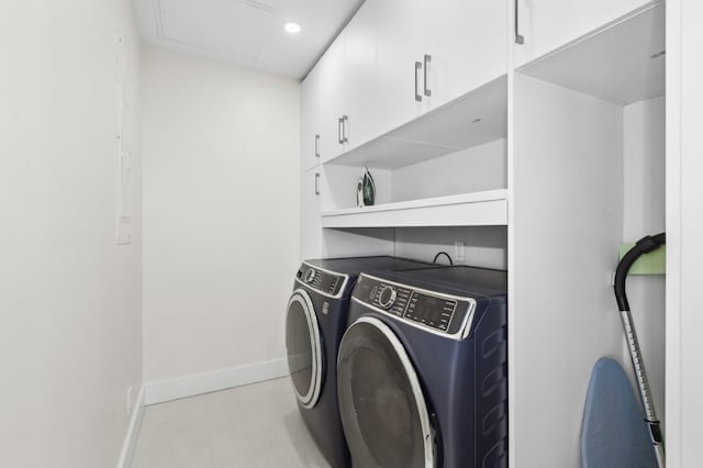 washroom with cabinets and separate washer and dryer