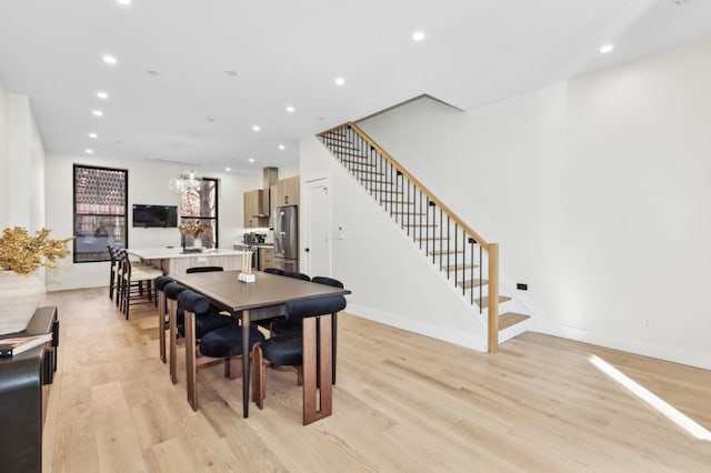 dining space with light wood-type flooring