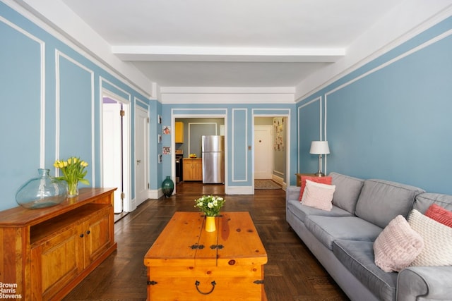 living room with dark parquet flooring and beam ceiling