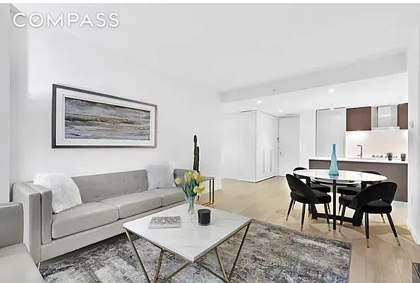 540 W 49th St Unit 406N, New York City, NY 10019 - living area with light wood-style floors and recessed lighting