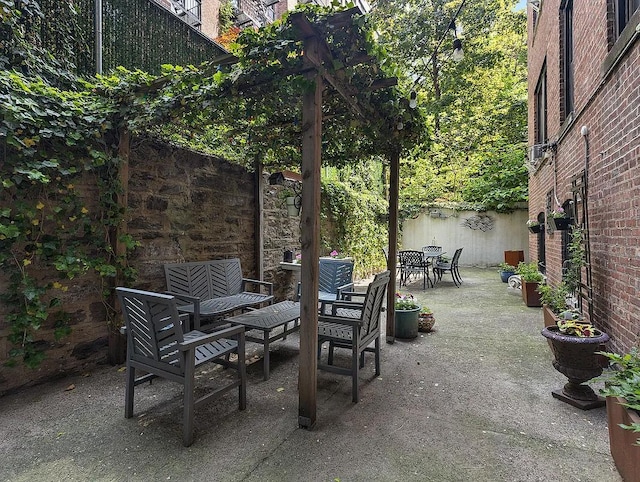 view of patio with fence and outdoor dining space
