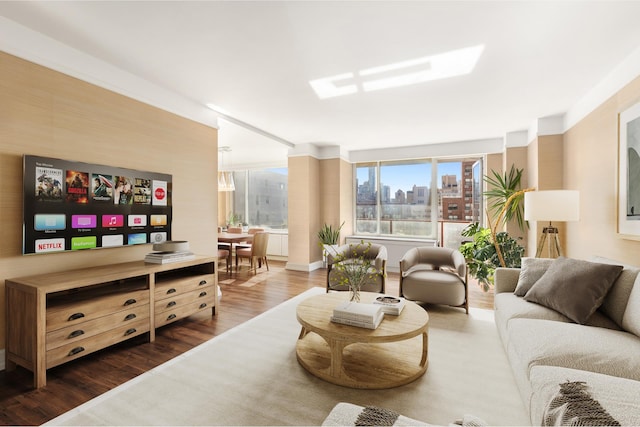 living area with a view of city and dark wood-style flooring