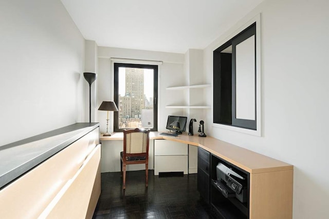 office area with dark parquet flooring