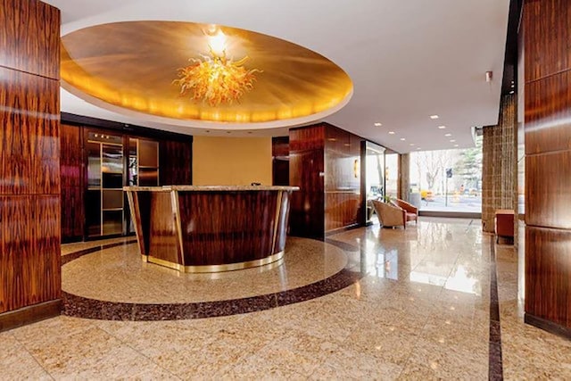 reception area featuring an inviting chandelier