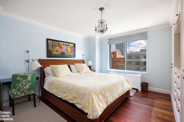 bedroom featuring a notable chandelier, crown molding, and dark hardwood / wood-style floors