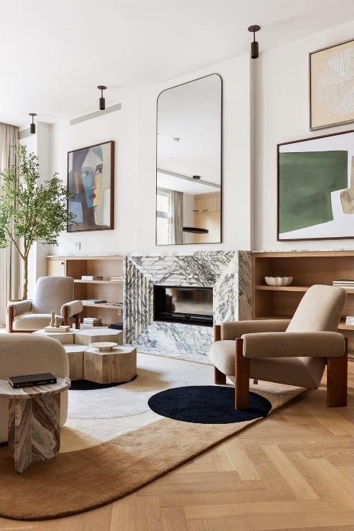 living area featuring parquet floors and a fireplace