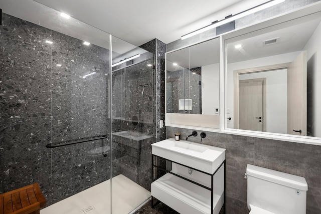 181 E 101st St Unit 606, New York City, NY 10029 - bathroom with a stall shower, vanity, and tile walls