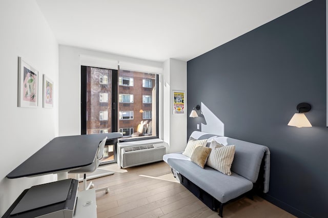 181 E 101st St Unit 606, New York City, NY 10029 - office area with wood-type flooring and an AC wall unit