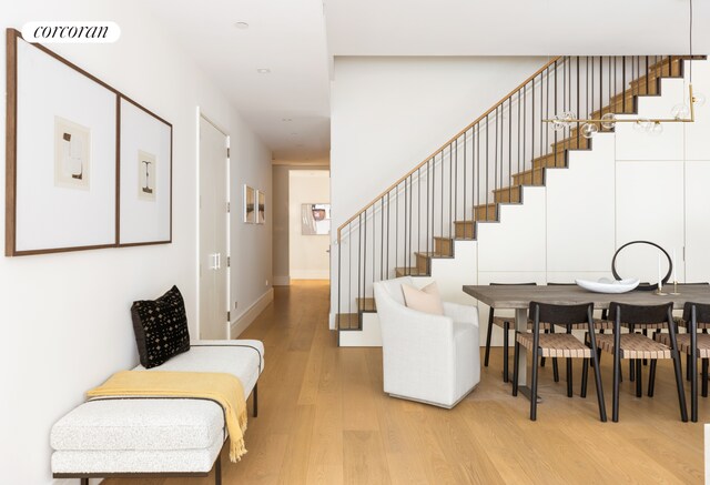 stairs featuring hardwood / wood-style flooring