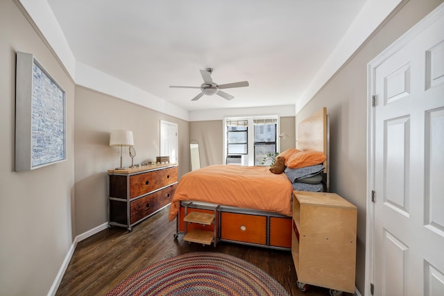 bedroom with baseboards, wood finished floors, and a ceiling fan