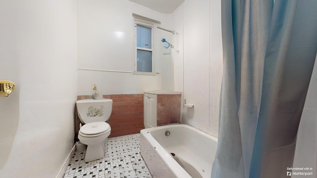 bathroom with vanity, tile patterned floors, toilet, and baseboards