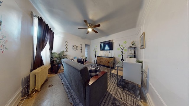 living room featuring radiator heating unit and ceiling fan