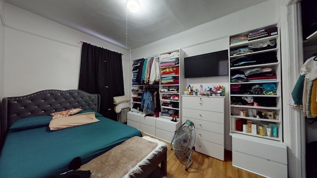 bedroom featuring wood finished floors