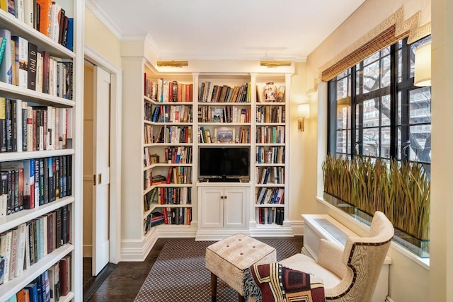 sitting room featuring crown molding and dark hardwood / wood-style flooring