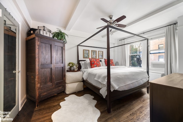 bedroom with dark wood-style floors, beamed ceiling, and a ceiling fan