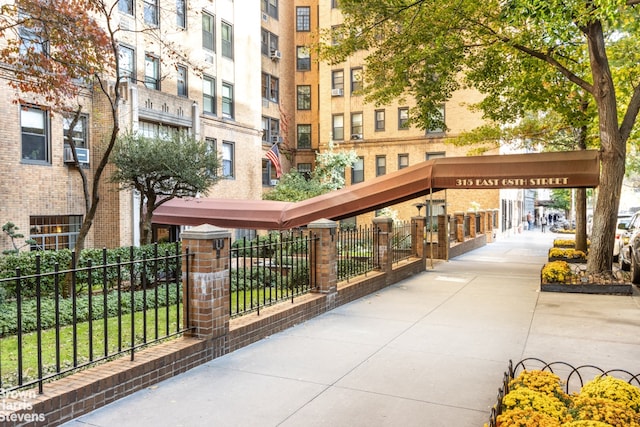 view of property's community featuring fence