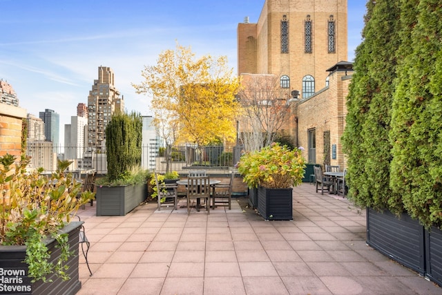 view of patio / terrace featuring a city view