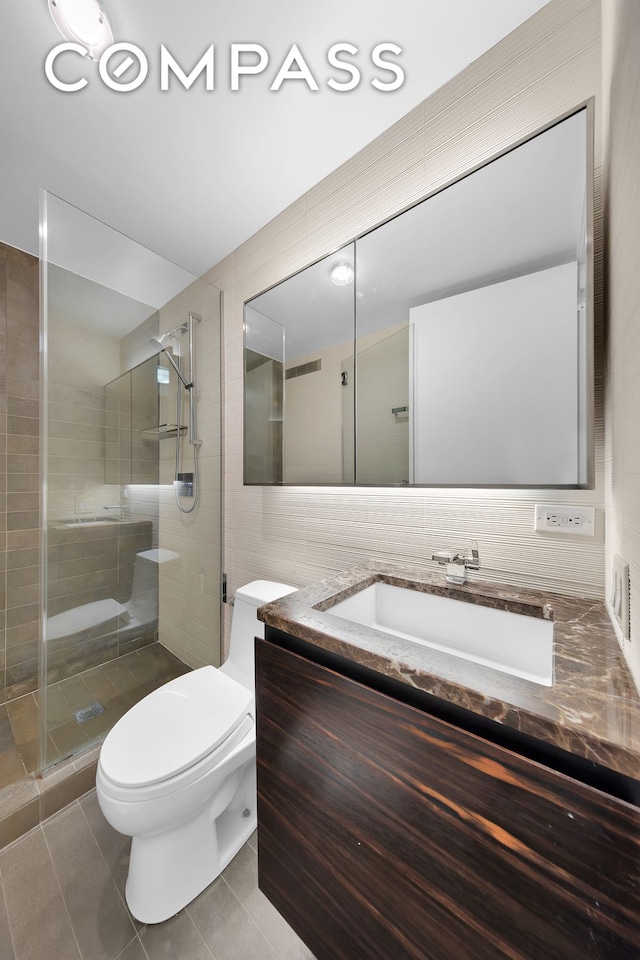 full bathroom with tile patterned flooring, toilet, visible vents, vanity, and a shower stall