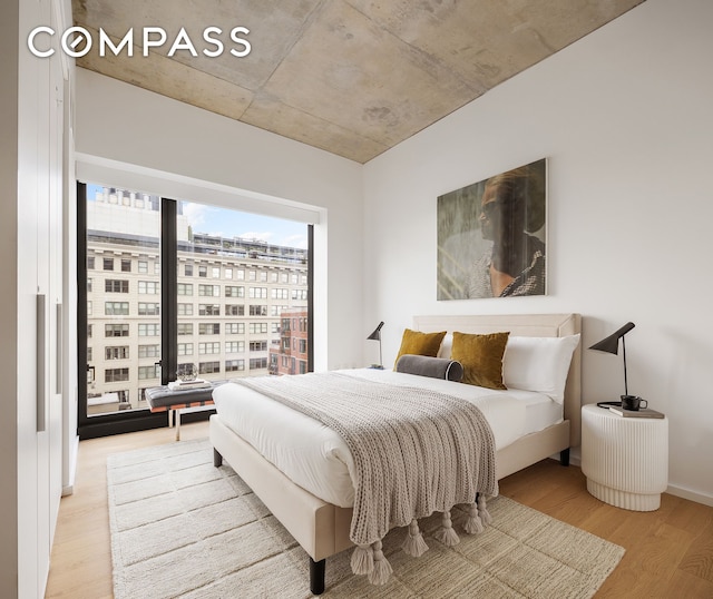 bedroom featuring light wood-style flooring