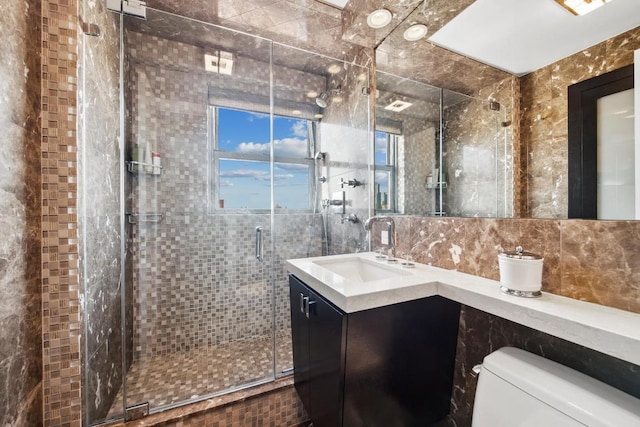 bathroom with tasteful backsplash, vanity, toilet, and walk in shower