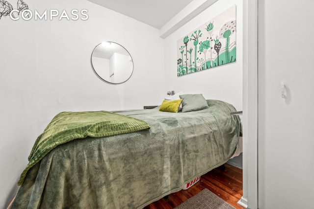 bedroom with wood finished floors