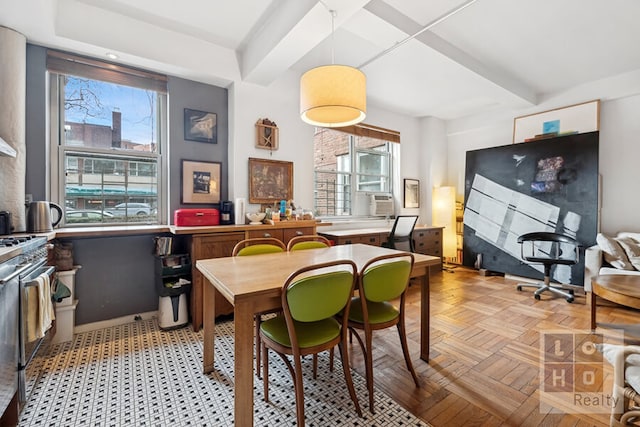 dining space featuring cooling unit, a wealth of natural light, and beamed ceiling