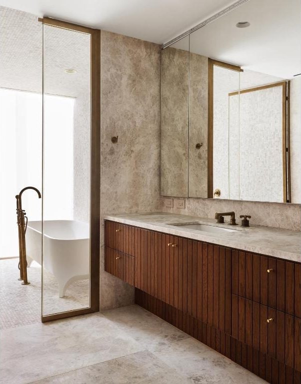 bathroom featuring vanity and a bath