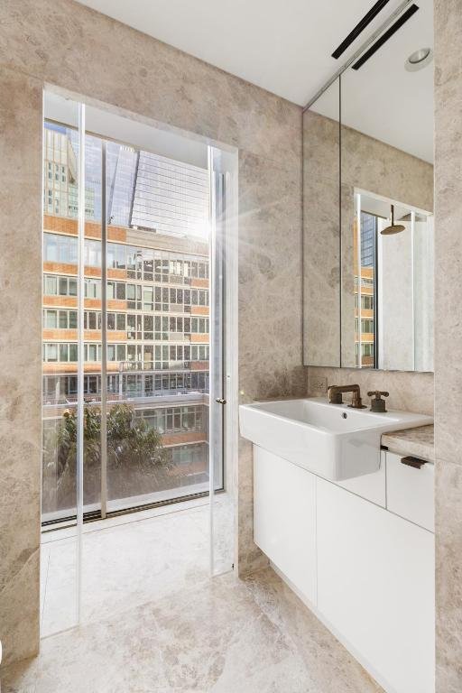 bathroom featuring vanity and ceiling fan