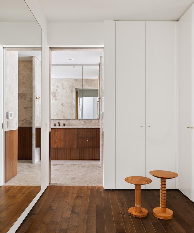 527 W 27th St Unit 9A, New York City, NY 10001 - hallway featuring dark wood finished floors and wainscoting