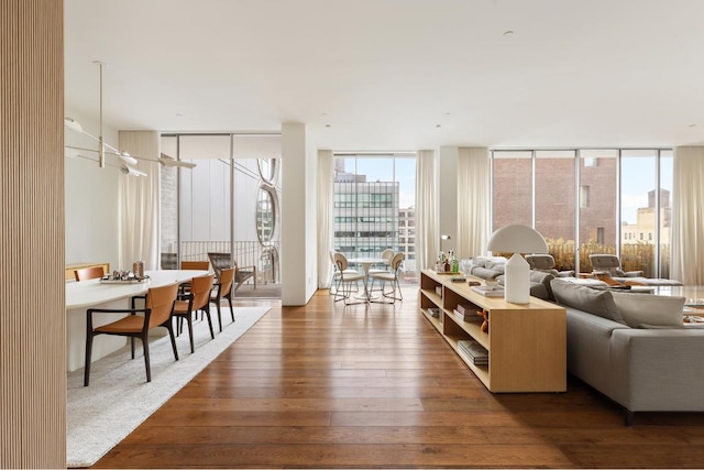 living room with wood-type flooring and expansive windows