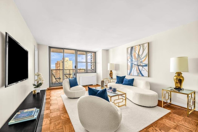 living room featuring parquet flooring