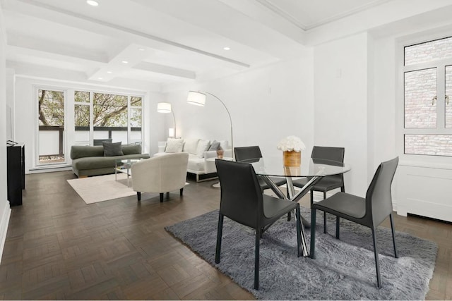 dining area with beam ceiling and dark parquet floors