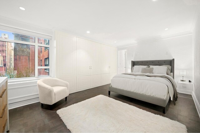 bedroom with recessed lighting and crown molding