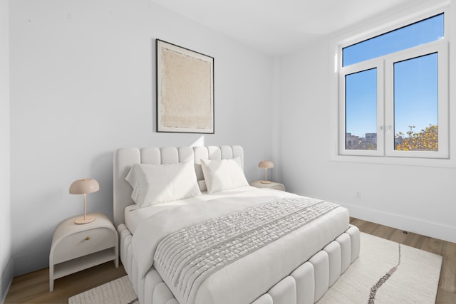 bedroom with wood-type flooring