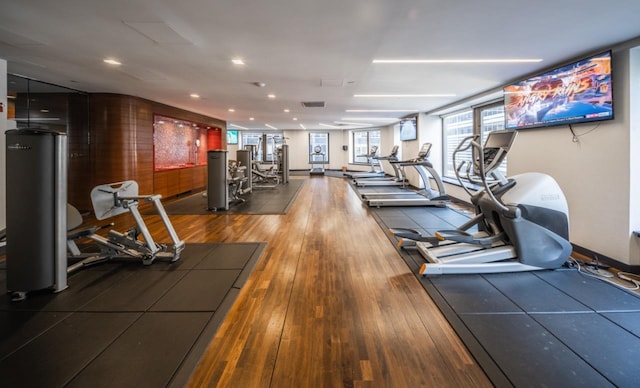 workout area with wood-type flooring