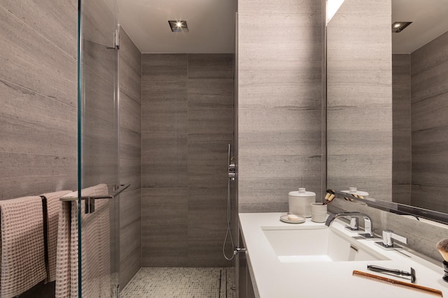 full bath featuring a stall shower and vanity