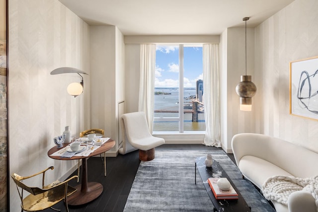 252 S St Unit 66B, New York City, NY 10002 - living area with wallpapered walls, wood finished floors, a water view, and baseboards