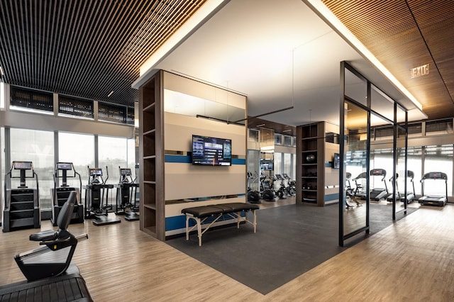 exercise room with wood finished floors