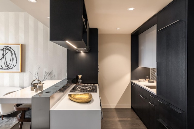 252 S St Unit 66B, New York City, NY 10002 - kitchen featuring dark cabinets, wallpapered walls, modern cabinets, baseboards, and dark wood-style floors