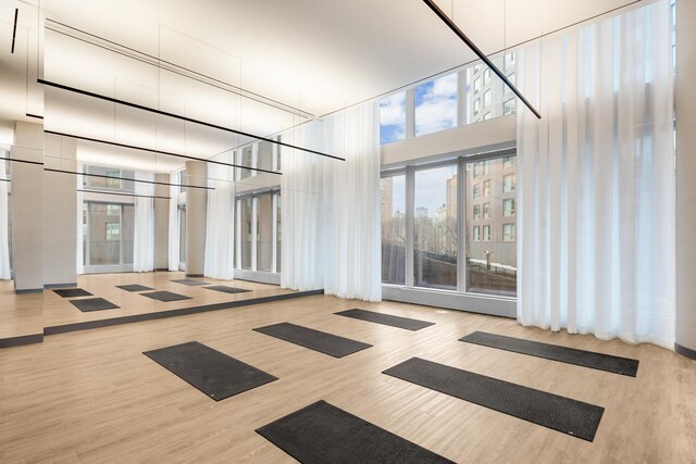 252 S St Unit 66B, New York City, NY 10002 - spare room with a high ceiling and wood finished floors