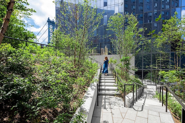 view of property's community featuring stairs