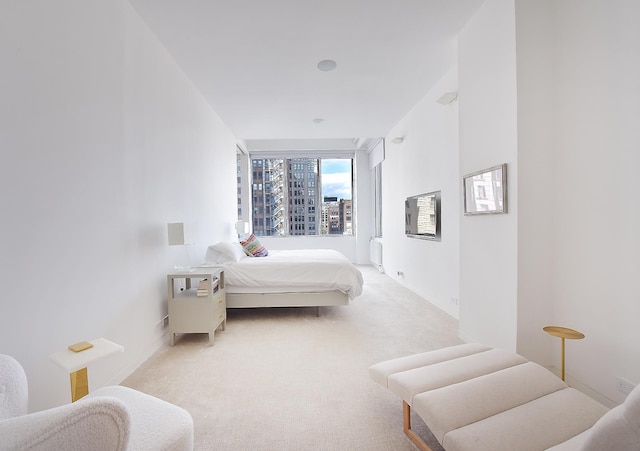 carpeted bedroom with baseboards