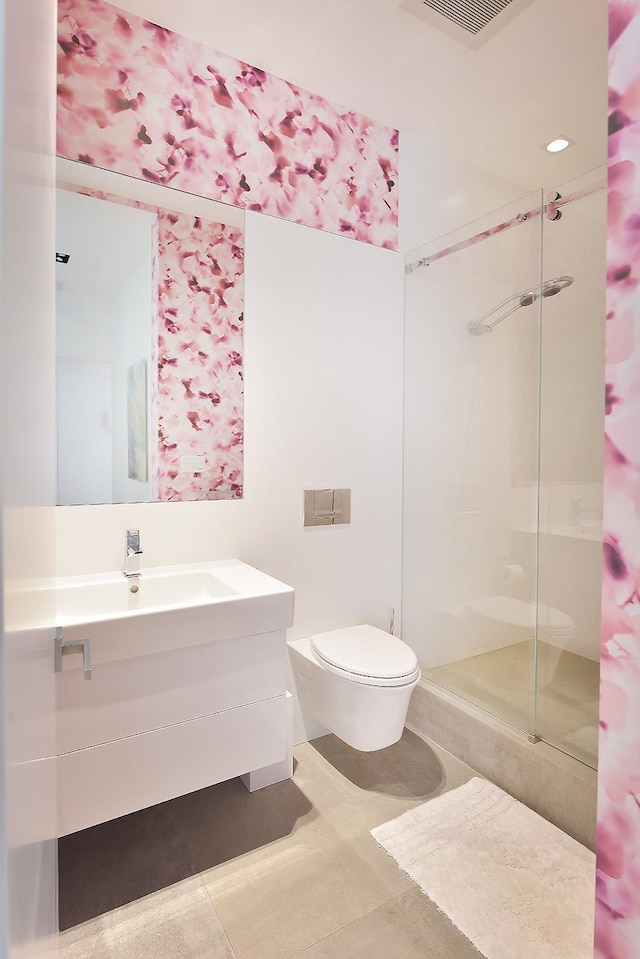 bathroom featuring tile patterned flooring, visible vents, a shower stall, toilet, and vanity