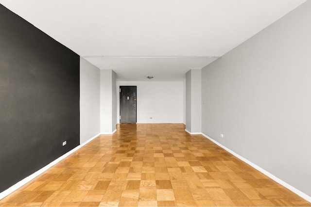 empty room with light parquet flooring