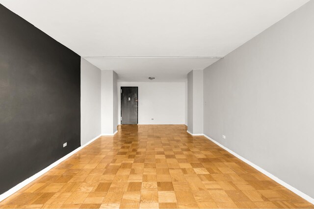 empty room with baseboards