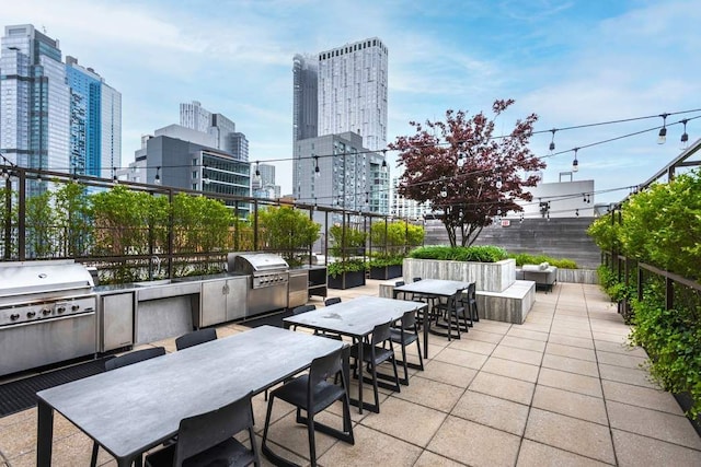 view of patio with area for grilling and exterior kitchen