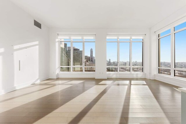 unfurnished sunroom with plenty of natural light